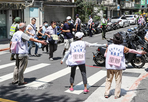 22日台北市民政局举行广居里防空避难处所演练,图自“中央社”